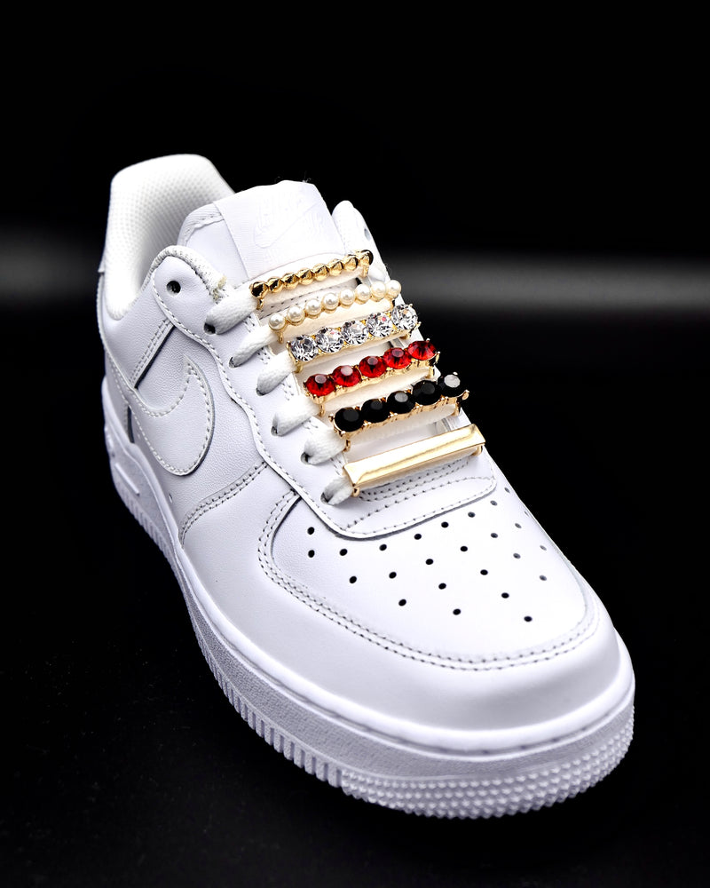 Nike Air Force 1 sneakers with gold, studs, bar, pearls, red and black rhinestone shoelace charm decorations