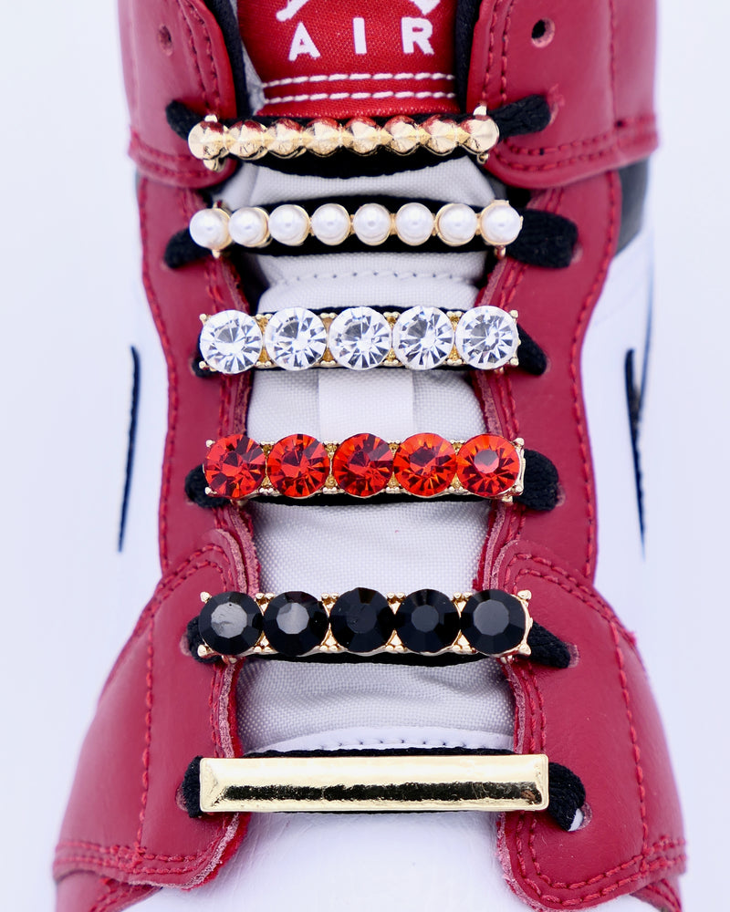 Nike Air Jordan 1 Chicago sneakers with gold, studs, bar, pearls, red and black rhinestone shoelace charm decorations