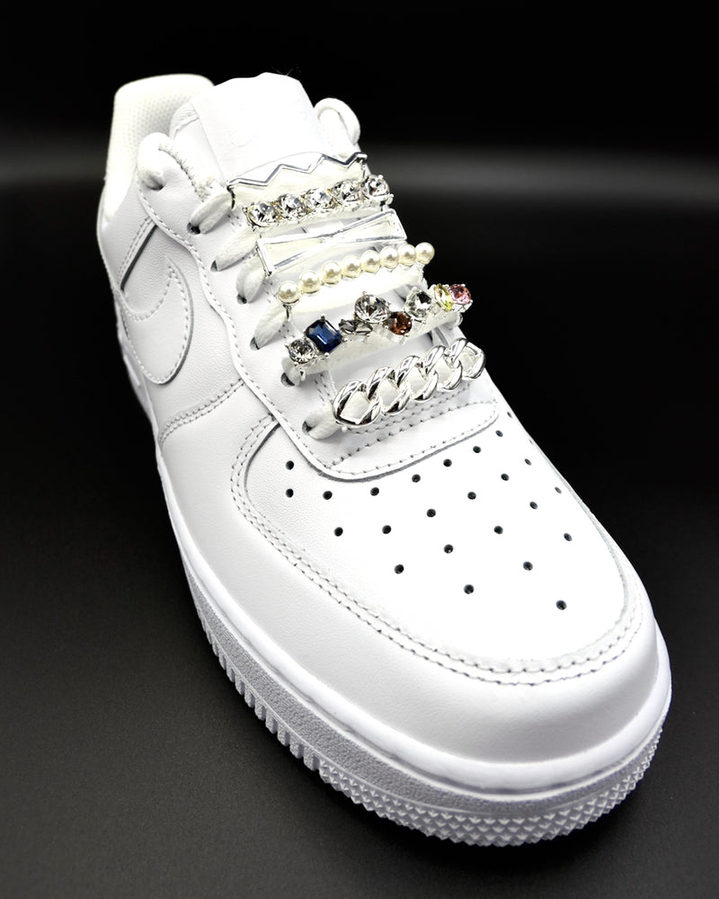 White Nike Air Force 1 and Jordan 1 sneakers with silver,  pearls, multicolor rhinestone shoelace charm decorations