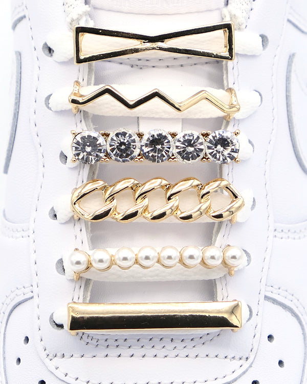 White Nike Air Force 1 and Jordan 1 sneakers with gold,  pearls, crystal bling rhinestone shoelace charm decorations